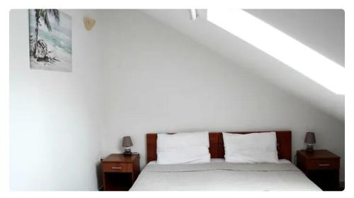 Tempat tidur dalam kamar di Дарина