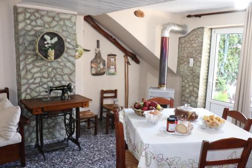 a kitchen with a table and a stove at Mary's house in Makrikhórion