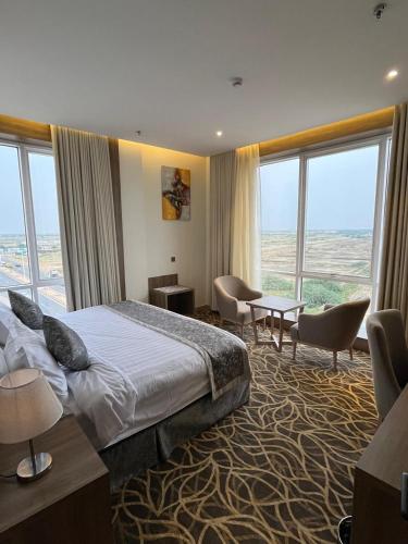 Postel nebo postele na pokoji v ubytování Rafid Hotel Jazan - فندق رفيد جازان