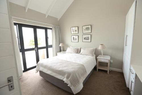 Ένα ή περισσότερα κρεβάτια σε δωμάτιο στο Lagoon Terrace 1