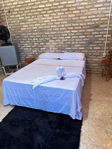 Ein Bett oder Betten in einem Zimmer der Unterkunft Pousada Sol Nascente