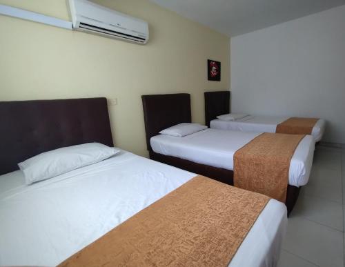 Hotel Parque del Perroにあるベッド