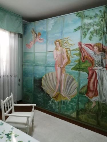 a room with a mural of mermaids on the wall at B&B La Casa di Rita in Castrezzato