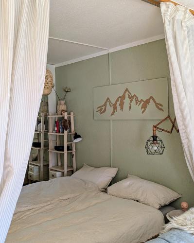 a bedroom with two beds and a wall at Residenz Majesta in Leukerbad