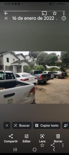 a view of a parking lot with cars parked at Alta Vista de Cahuil in Pichilemu
