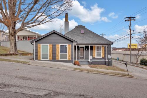a small house on the side of a street at Lenoir City Cottage - Remodeled - Close to Lake in Lenoir City