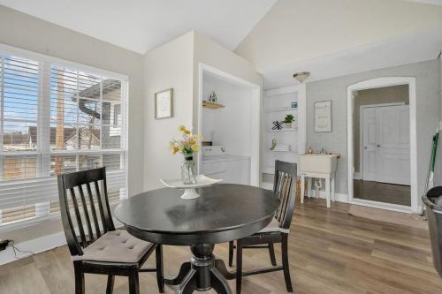 a kitchen and dining room with a table and chairs at Lenoir City Cottage - Remodeled - Close to Lake in Lenoir City
