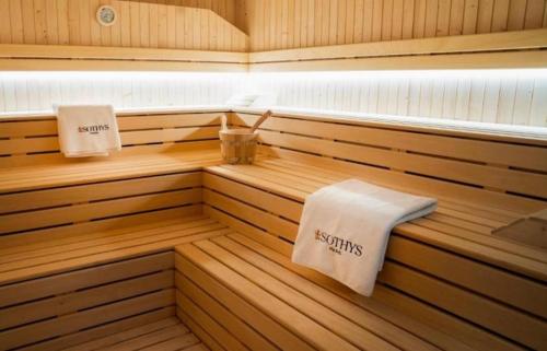 a sauna with two towels on the inside of it at New CP Luxury studio with spa in Gibraltar