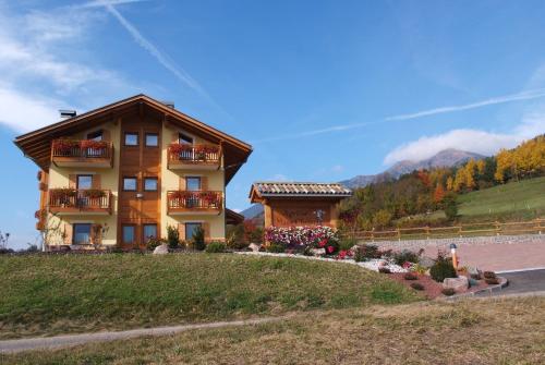 a house on the side of a hill at Agritur Maso Chemela in Cavalese