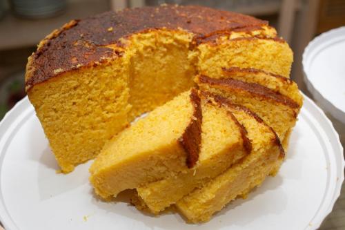 a piece of cake on a white plate at Pousada da Terra in Natal