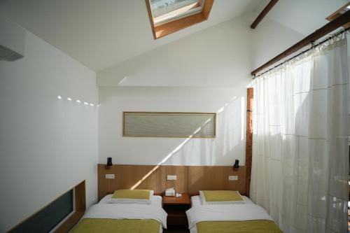 Postel nebo postele na pokoji v ubytování 黄山绪礼民宿