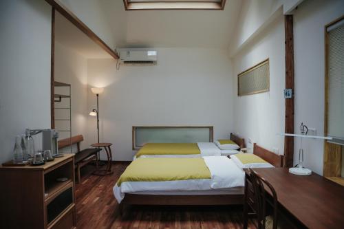 Una cama o camas en una habitación de 黄山绪礼民宿