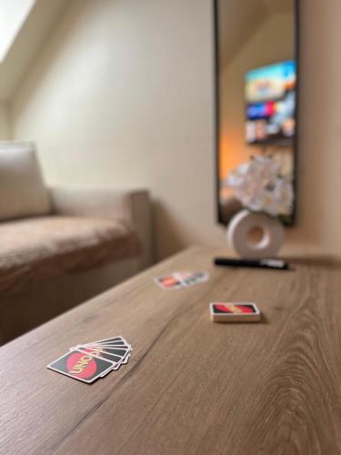 a table in a room with stickers on it at L Escapade, nature et aventure - Lac de Guerledan in Plussulien