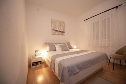 Ένα ή περισσότερα κρεβάτια σε δωμάτιο στο Apartment Neva