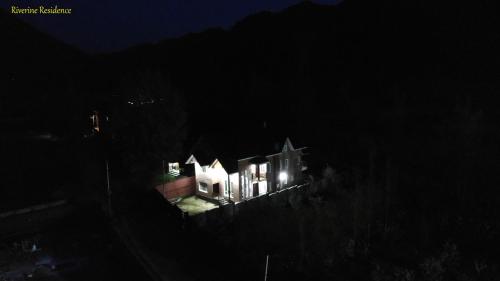 a house at night with its lights on at Riverine Residence in Nu Chid