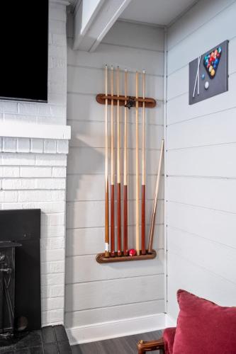a living room with a fireplace with baseball bats at Charming Retreat with Pool Table in Chesterfield! in Chesterfield