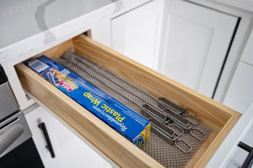 a drawer in a kitchen with a box of food at Charming Retreat with Pool Table in Chesterfield! in Chesterfield