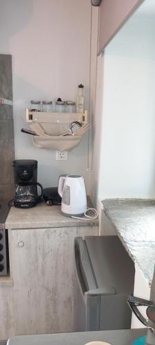 a kitchen with a counter with a toaster on it at Vounios house in Manganítis