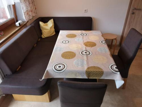 a table with a table cloth on top of a couch at Haus Neurauter in Mötz