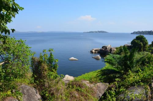a large body of water with rocks in it at Safari Junction Backpackers Hostel Mwanza in Mwanza