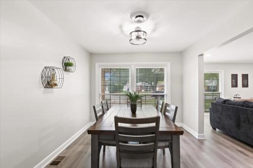 a dining room with a table and a couch at Westchester Retreat King bed in Westchester