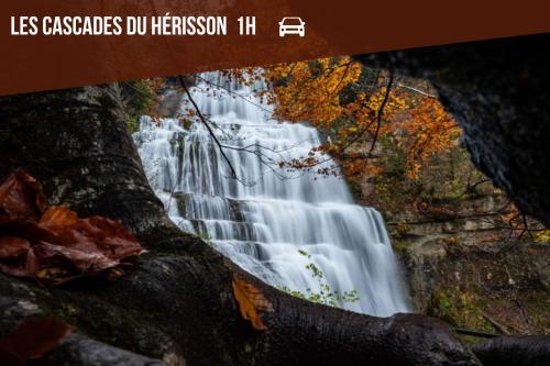 a picture of a waterfall with the words less cascades do herremon h at LE COTTAGE Zen LOVE in Foucherans