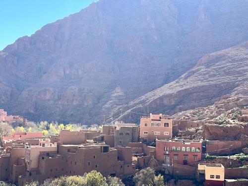 a small town in front of a mountain at Dounia Hostel in Tinerhir