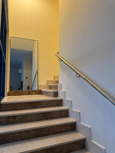 a staircase in a building with a hallway at Extraordinary 6 Bedroom Villa in Abu Dhabi - Group Getaway in Muşaffaḩ