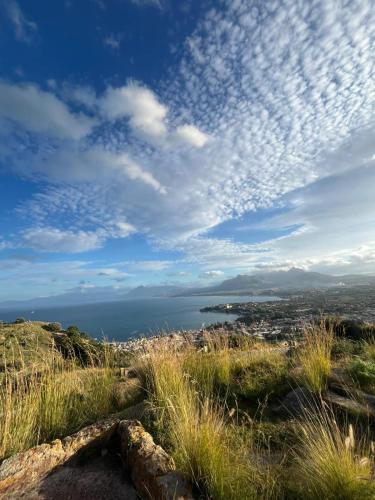 a view of the ocean from the top of a hill at Sea Living Sicilia Apartment in Santa Flavia