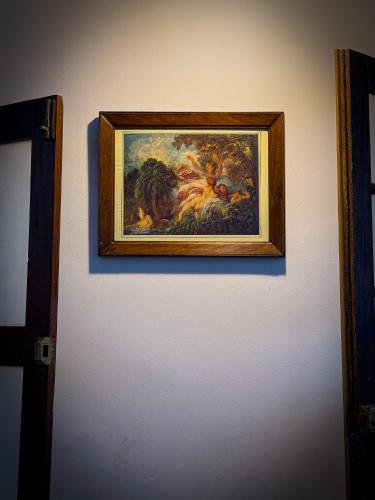a picture of a painting on a wall at House of Merchants in Galle