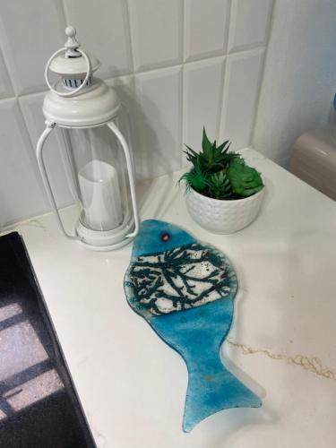 a blue bird ornament sitting on a kitchen counter at Seabliss Villa in Vieux Fort