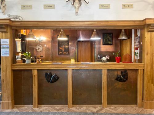 a bar in a restaurant withanimal heads on the wall at Apartmán Stanka 003 in Tatranska Strba