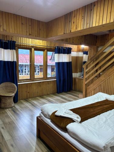Postel nebo postele na pokoji v ubytování Odyssey's Darap Eco Retreat