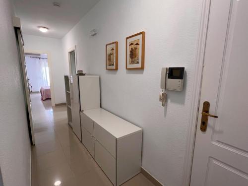 a room with a white refrigerator on a wall at Apartamento DELAMAR BAJEL46 in Carboneras