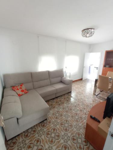a living room with a couch and a table at Jaén Ways in Jaén