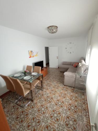 a living room with a table and a couch at Jaén Ways in Jaén