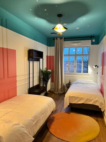 Postel nebo postele na pokoji v ubytování Dream Suite Deluxe