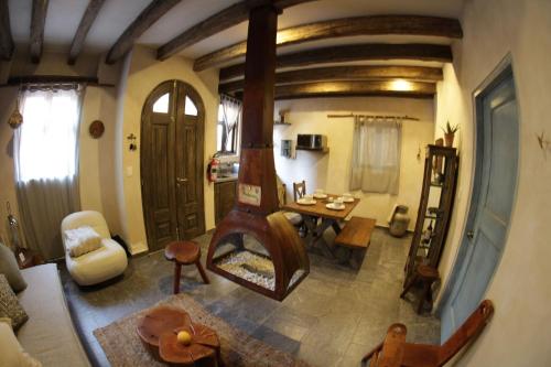 a room with a living room with a table and a room with a room at Vecchia Luna: The coziest spot in ValQuirico in Santeagueda