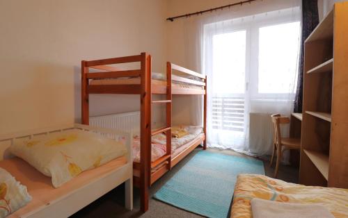 Postel nebo postele na pokoji v ubytování Penzion Tesák-ČERŇAVA