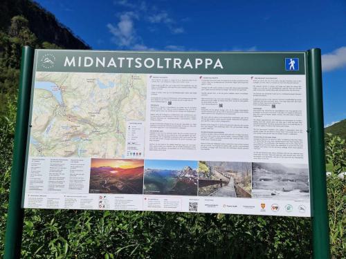 a sign on the side of a mountain at Cabin with lovely view in Lakså