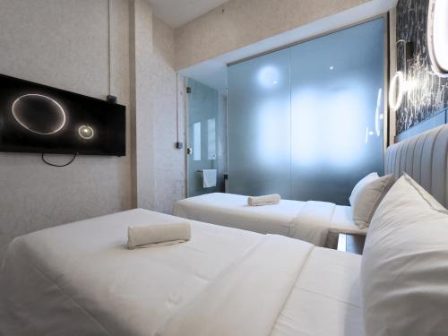 Postel nebo postele na pokoji v ubytování Kam Leng Hotel