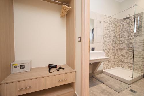 a bathroom with a toilet and a sink and a shower at Vista Blu Villa in Vlachata