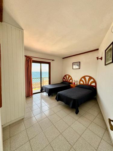 Postel nebo postele na pokoji v ubytování Mangos Mar D