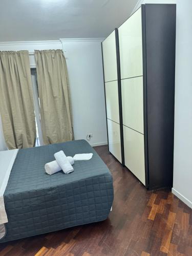 a bedroom with a bed with two towels on it at DOLCEVITA Eur Relax Home in Rome