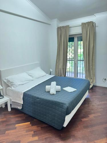 a bedroom with a bed with two towels on it at DOLCEVITA Eur Relax Home in Rome