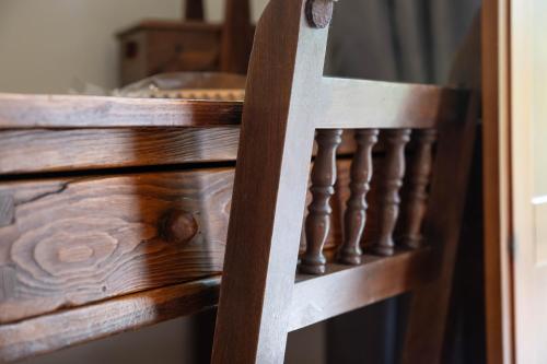 a close up of a wooden stair railing at HOTEL POSADA LaS RETAJAS in Medinaceli