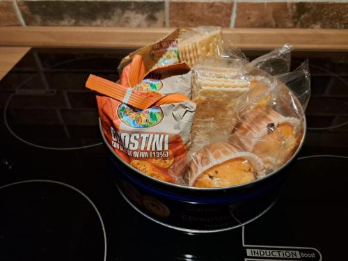 a bucket of food sitting on top of a stove at Frabosa Loft in Turin
