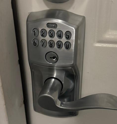 a close up of a door handle on a refrigerator at Lake Avenue Apartment in Cleveland