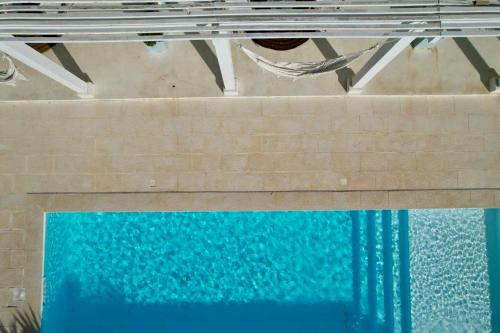 an overhead view of a pool of water at Herdade d' Amoreira Lavanda Villa in Aljezur