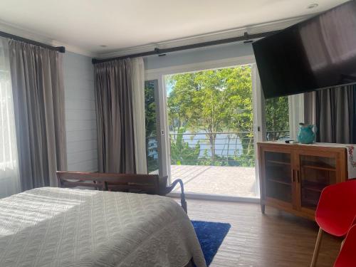 Postel nebo postele na pokoji v ubytování CASA DEL LAGO